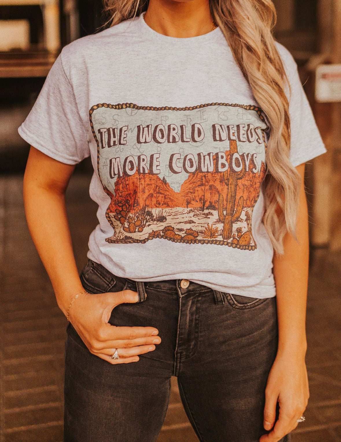 THE WORLD NEEDS MORE COWBOYS T-SHIRT